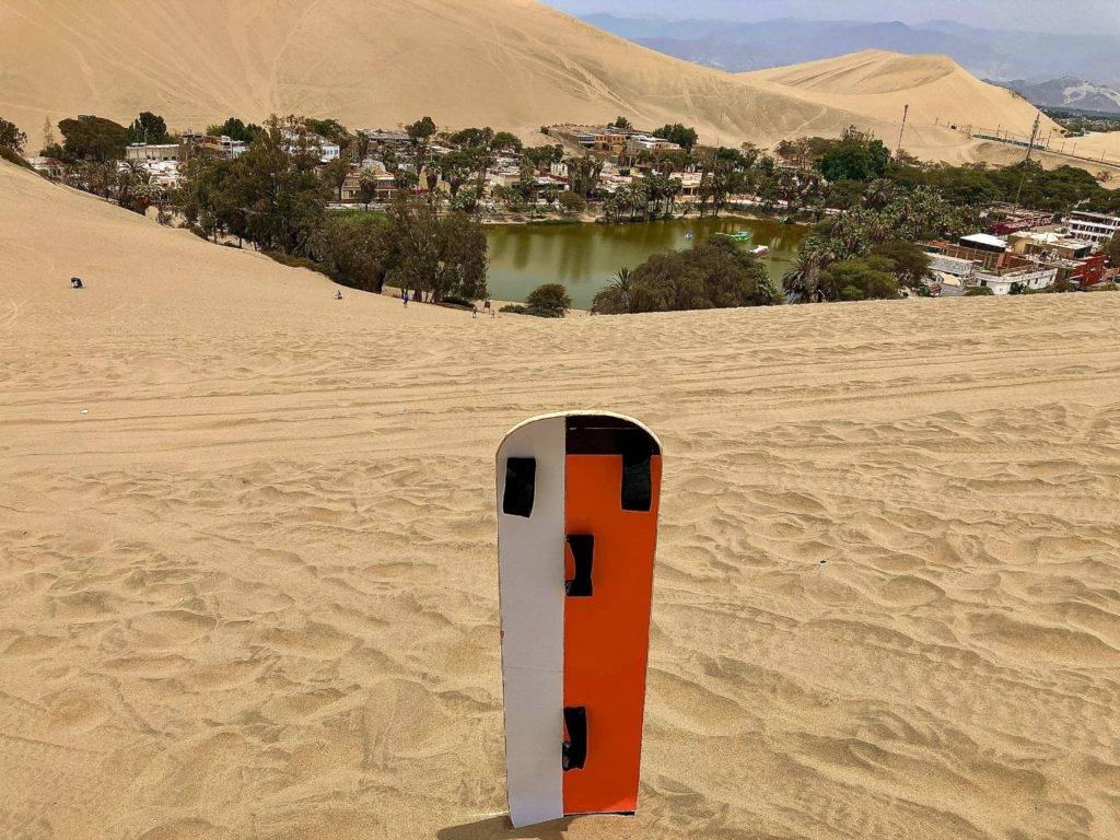 Sandboarding In Huacachina Perus Desert Oasis